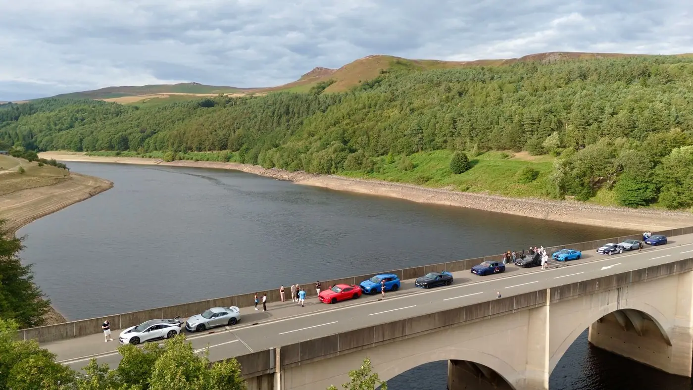 The convoy parked on a bridge over a reservoir in the Peak District